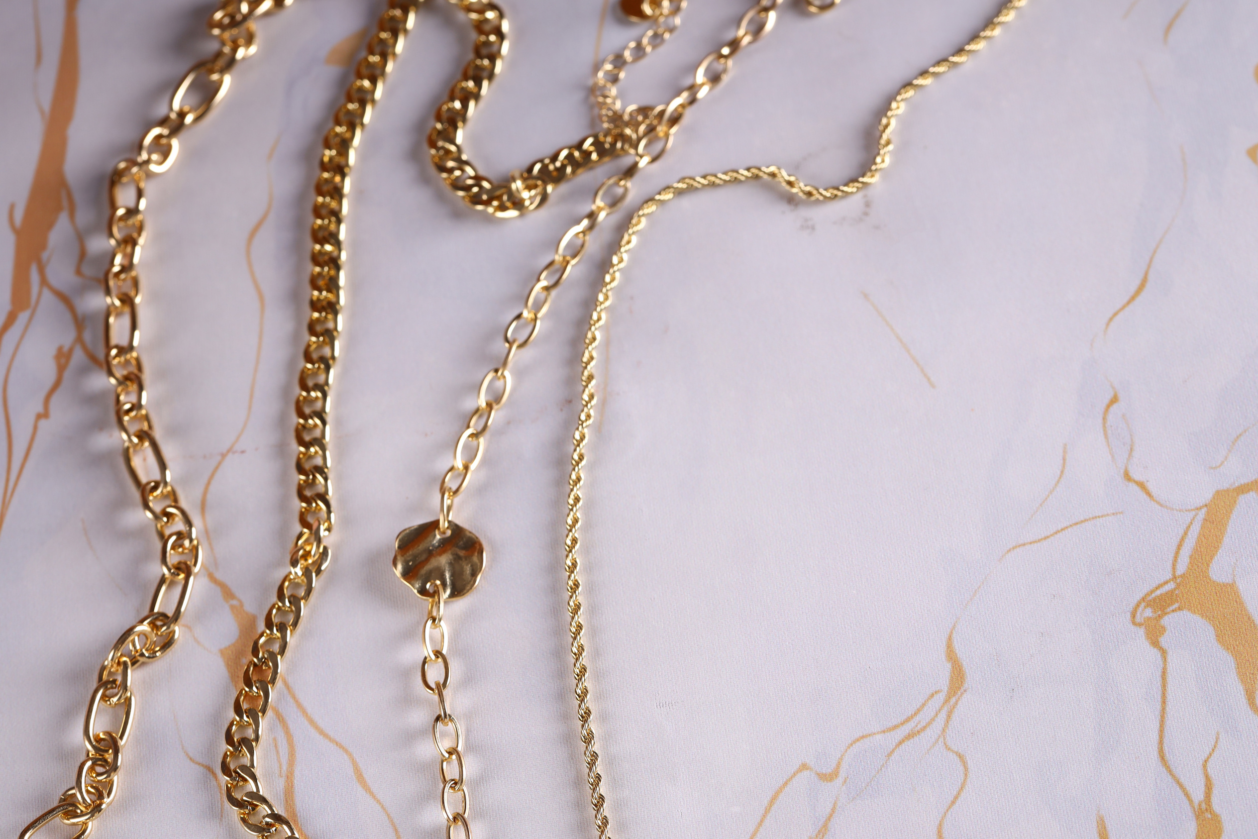 Gold Jewelry Chain Necklace on Background